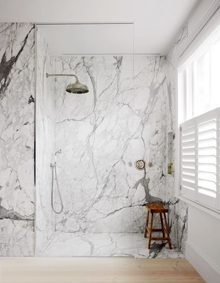 a bookmatched marble shower enclosure