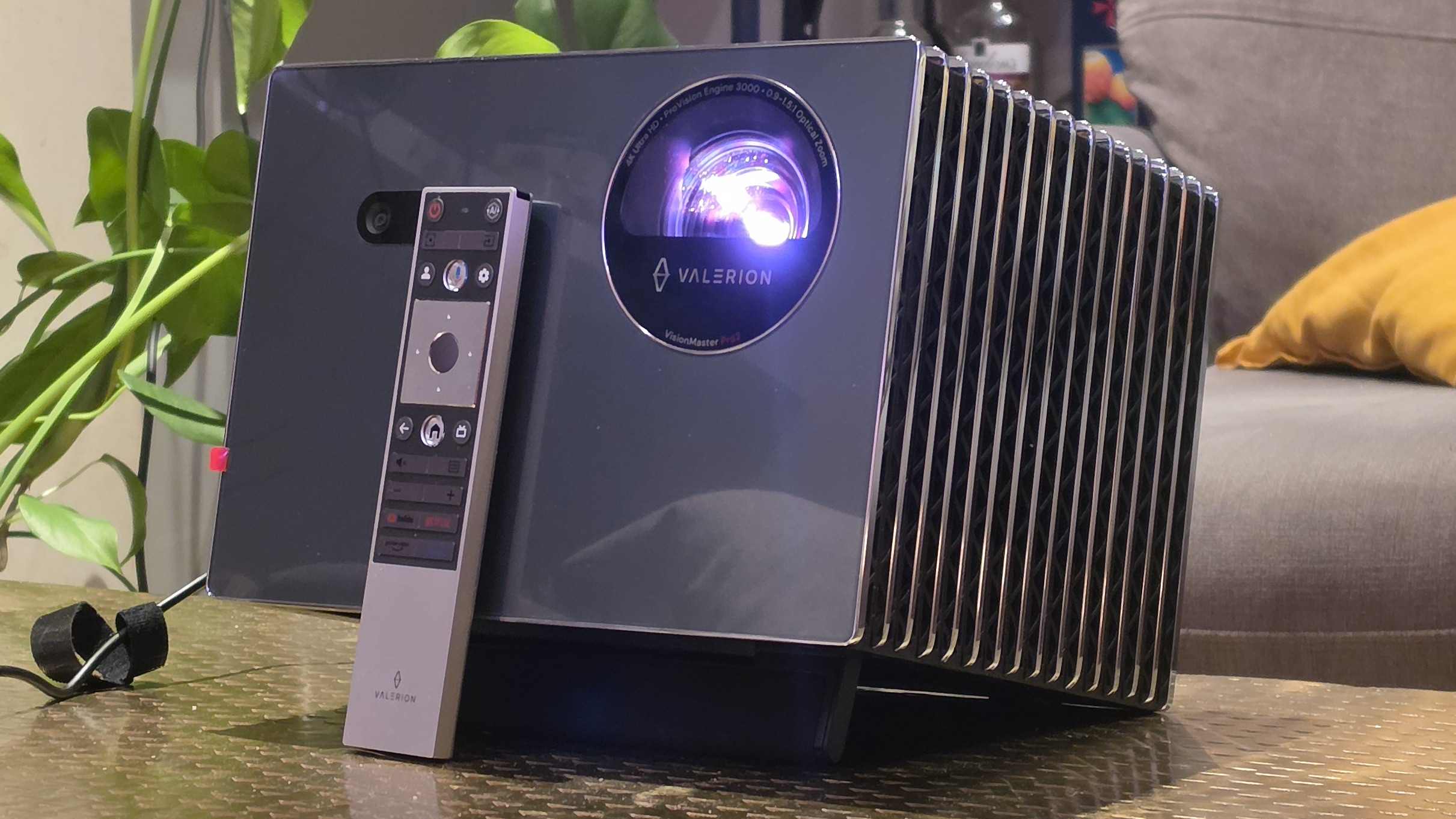 The Valerion VisionMaster 2 Pro on a table, with its remote leaning against it.