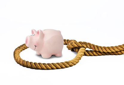 Rope noose around pink piggy bank