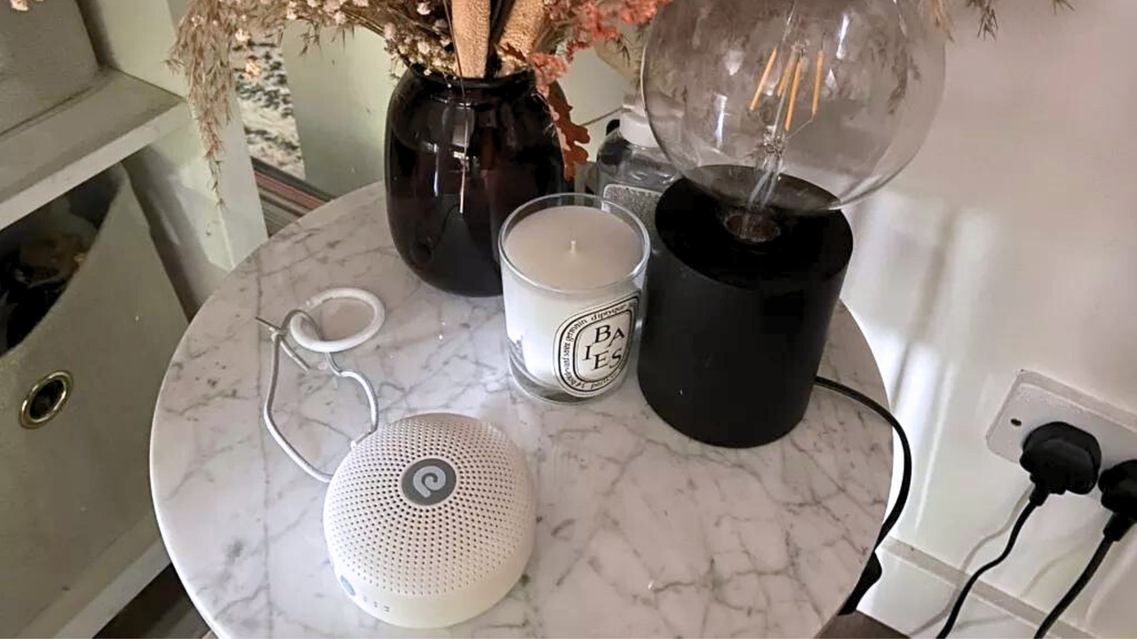 White noise machine on bedside table