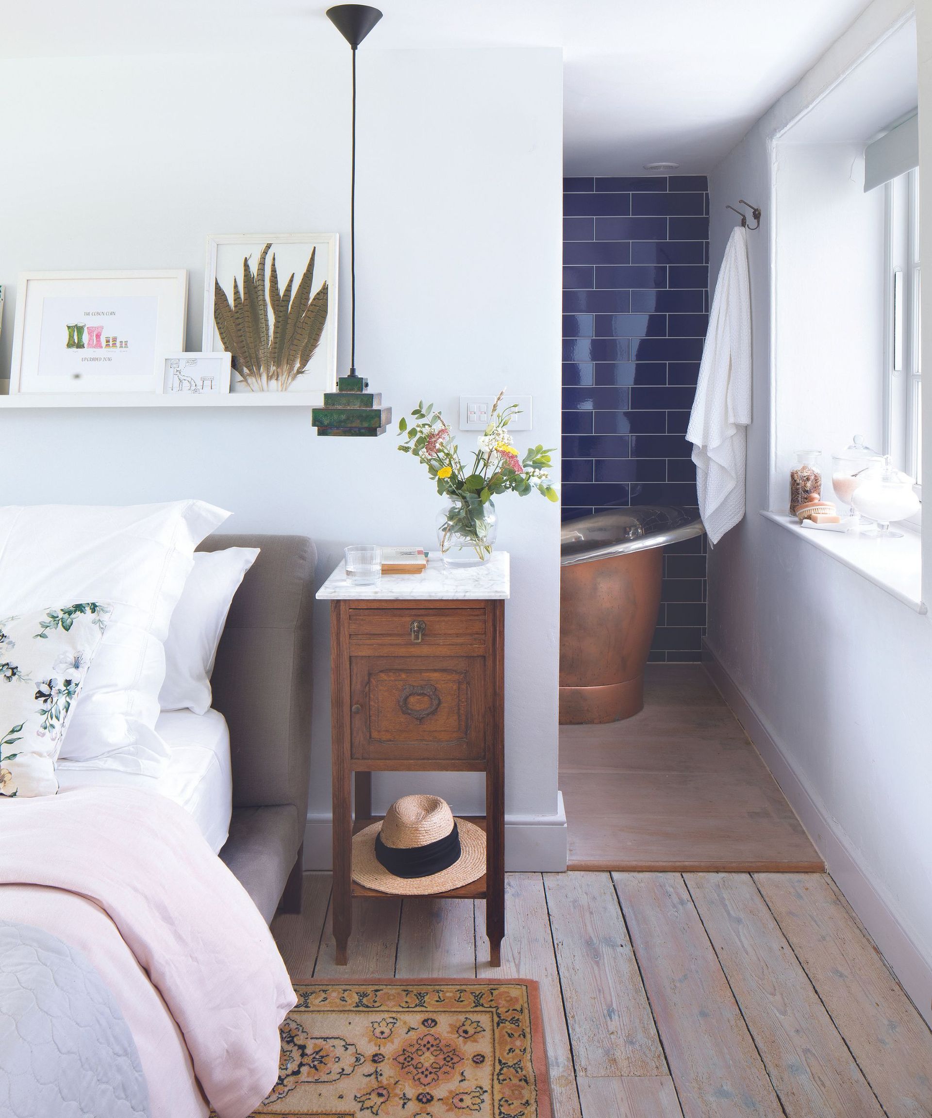 Wooden bedside table, green hanging lamp, wooden floor