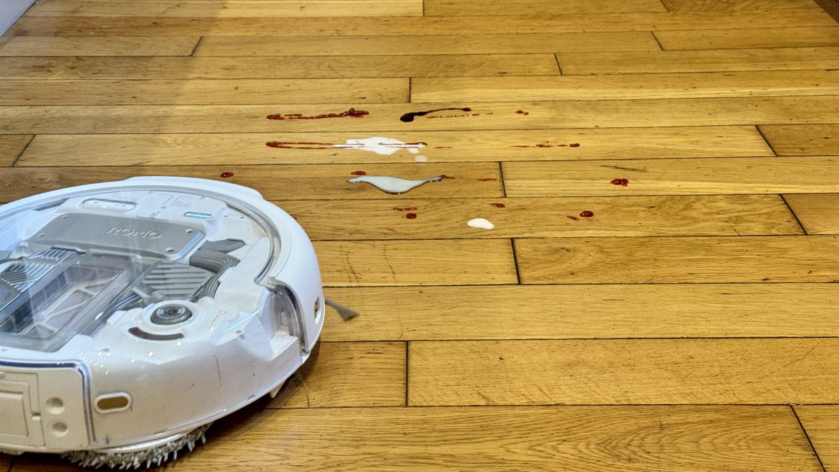 DJI Romo P robot vacuum about to mop milk from hard floor