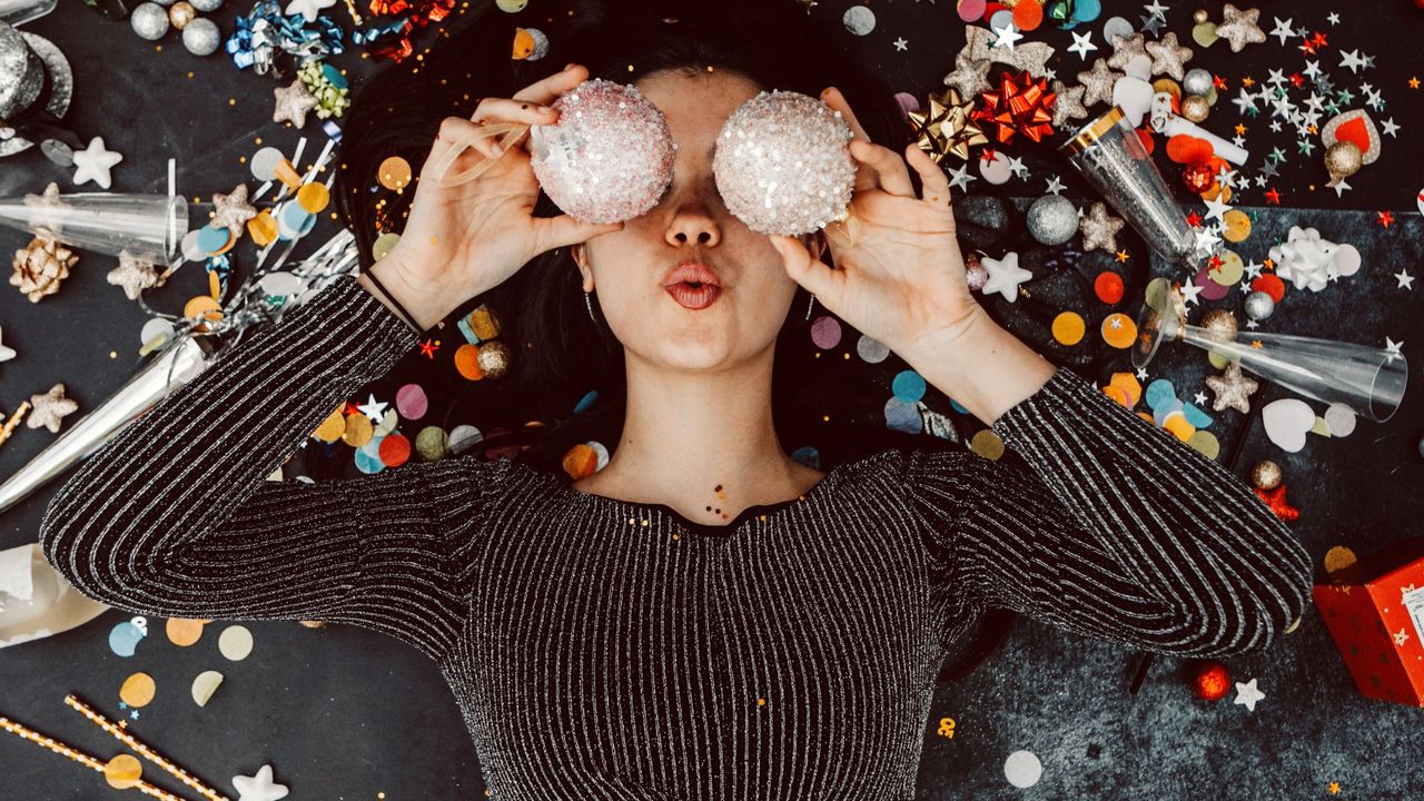 How to relieve stress quickly: A woman holding two baubles to her face