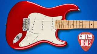 A red Fender Stratocaster on a blue background