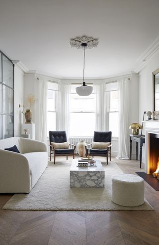 white living room with fireplace