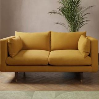 Mustard colour sofa in living room
