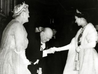 The Queen shakes hands with Churchill