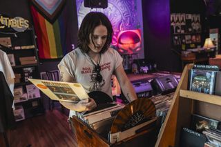 Tyler Bryant looking through the racks at Grimey's record store