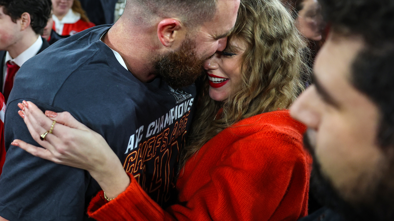 Travis Kelce #87 of the Kansas City Chiefs (L) celebrates with Taylor Swift after defeating the Baltimore Ravens in the AFC Championship Game at M&amp;T Bank Stadium on January 28, 2024 in Baltimore, Maryland.