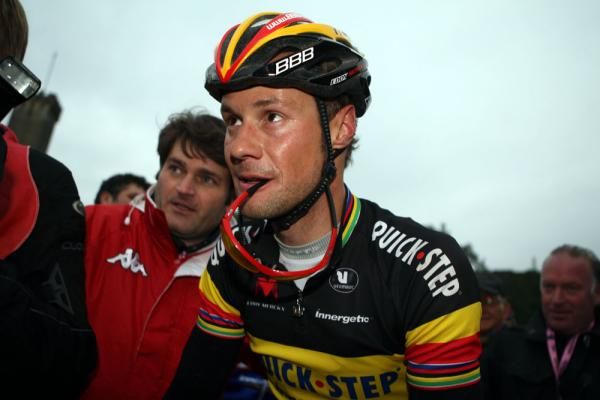 Tom Boonen (Quick Step) is escorted to the podium