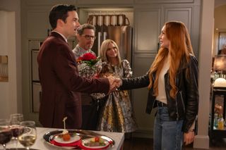 Lindsay Lohan and Ian Harding shake hands in 'Our Little Secret'