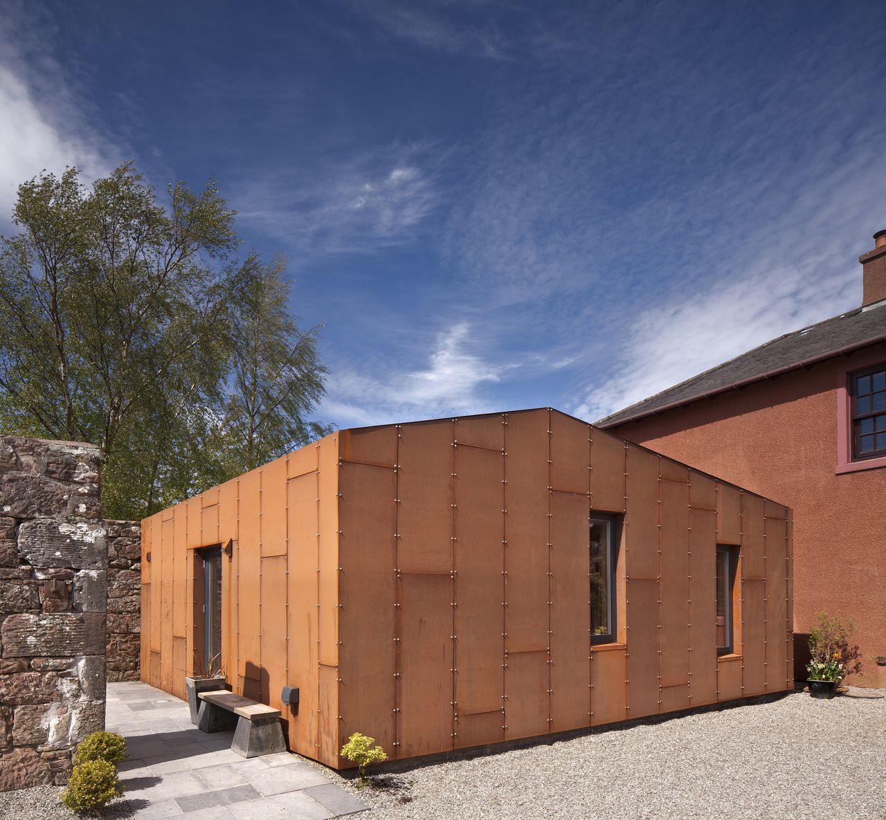 small corten clad extension to farmhouse