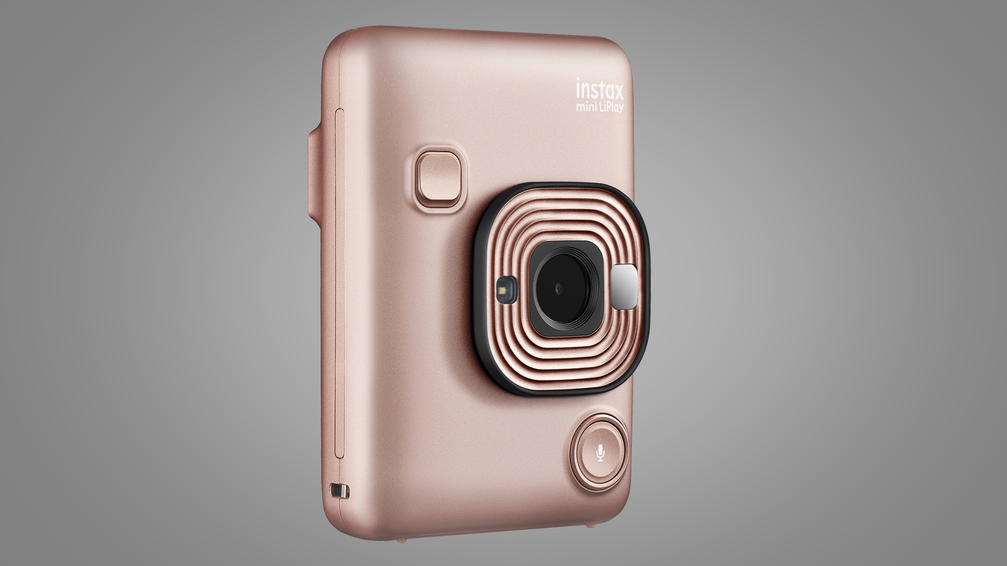 En rosa Fujifilm Instax Mini Liplay visas upp mot en grå bakgrund.