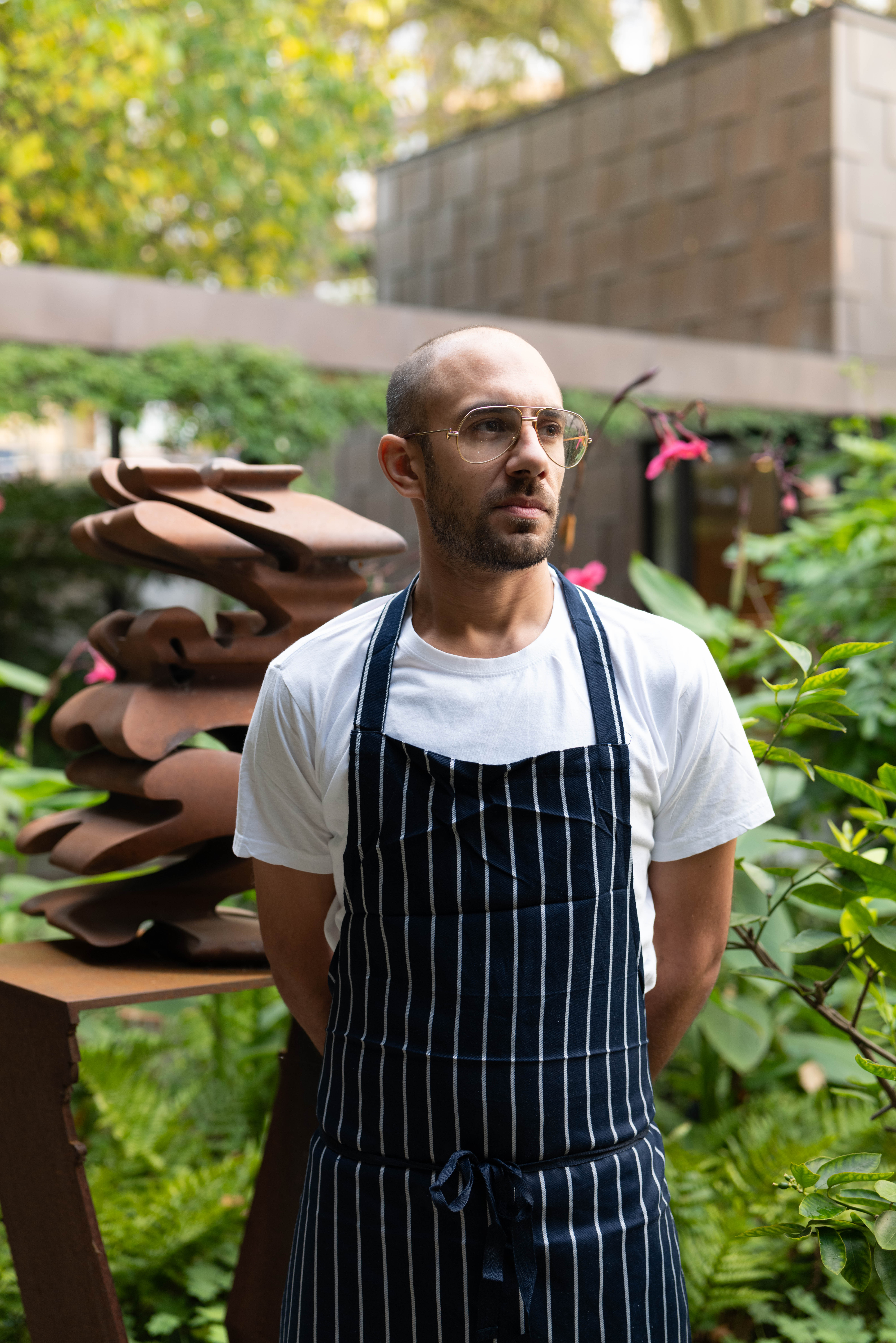 Myles Donaldson, head chef at the Garden Museum, in a stripe apron