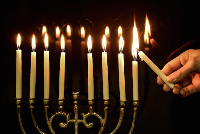 Lighting the menorah.