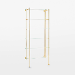brass wall-mounted bookshelf with glass shelves