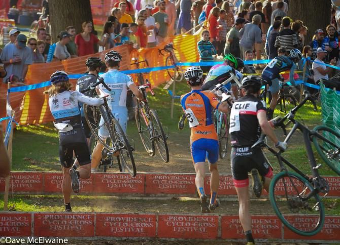 Racers pass by the busy beer garden