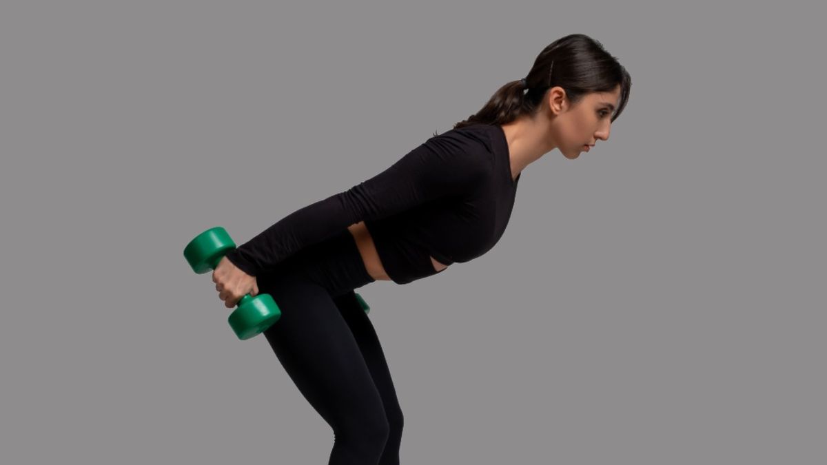 Standing two-arm dumbbell kickback exercise instructions and video