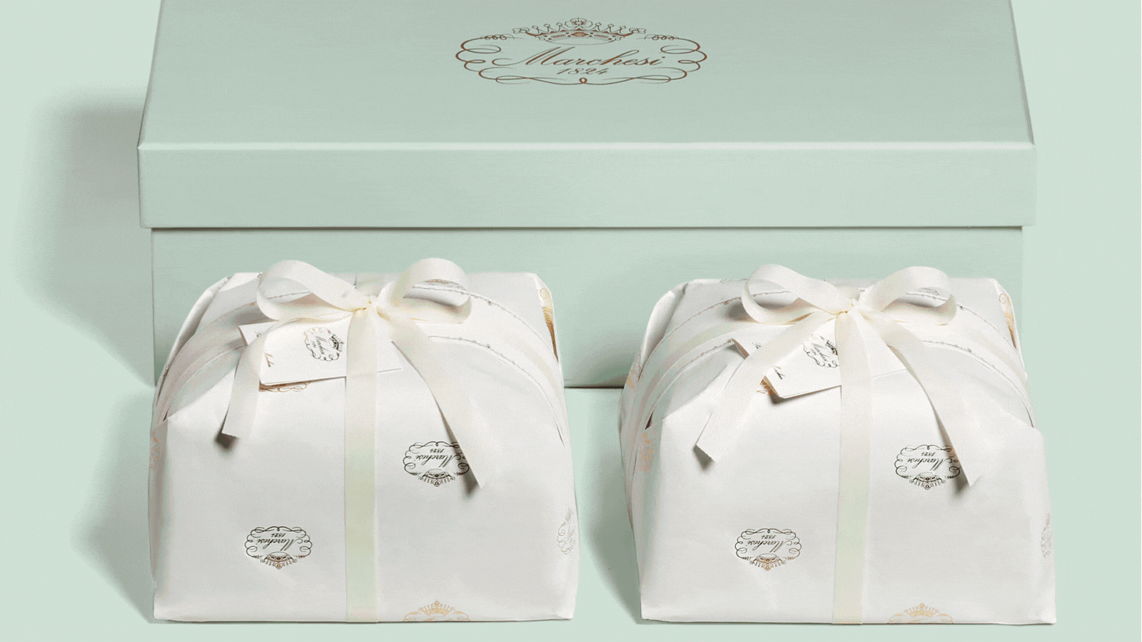 A rotating gif of high-end panettone boxes and tins, all shots beautifully against pale mint green or yellow backgrounds.