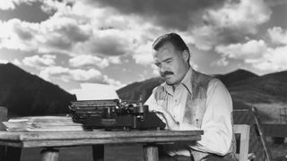 Author Ernest Hemingway writing on a typewriter