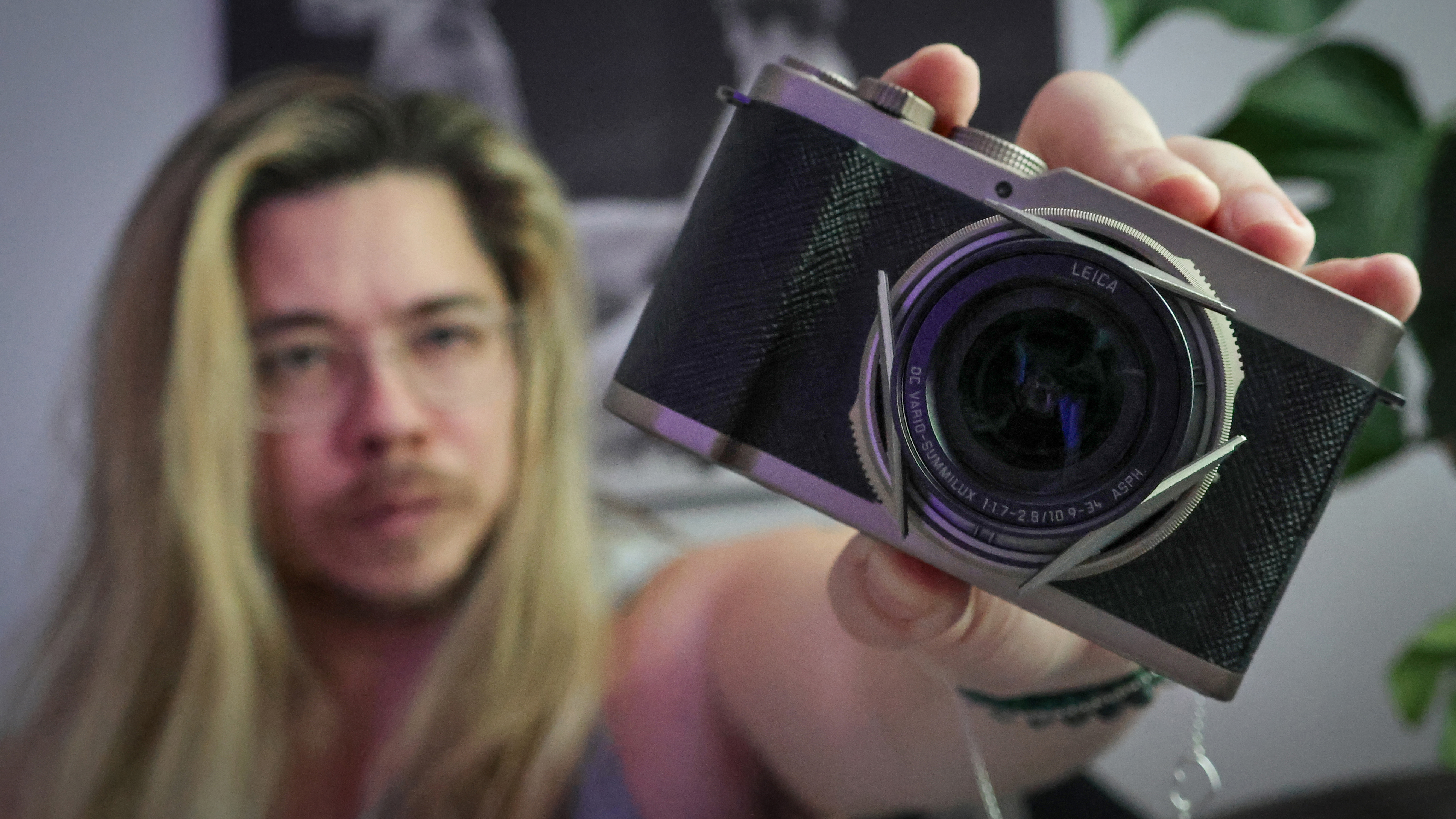James Artaius holding a Panasonic Lumix L10