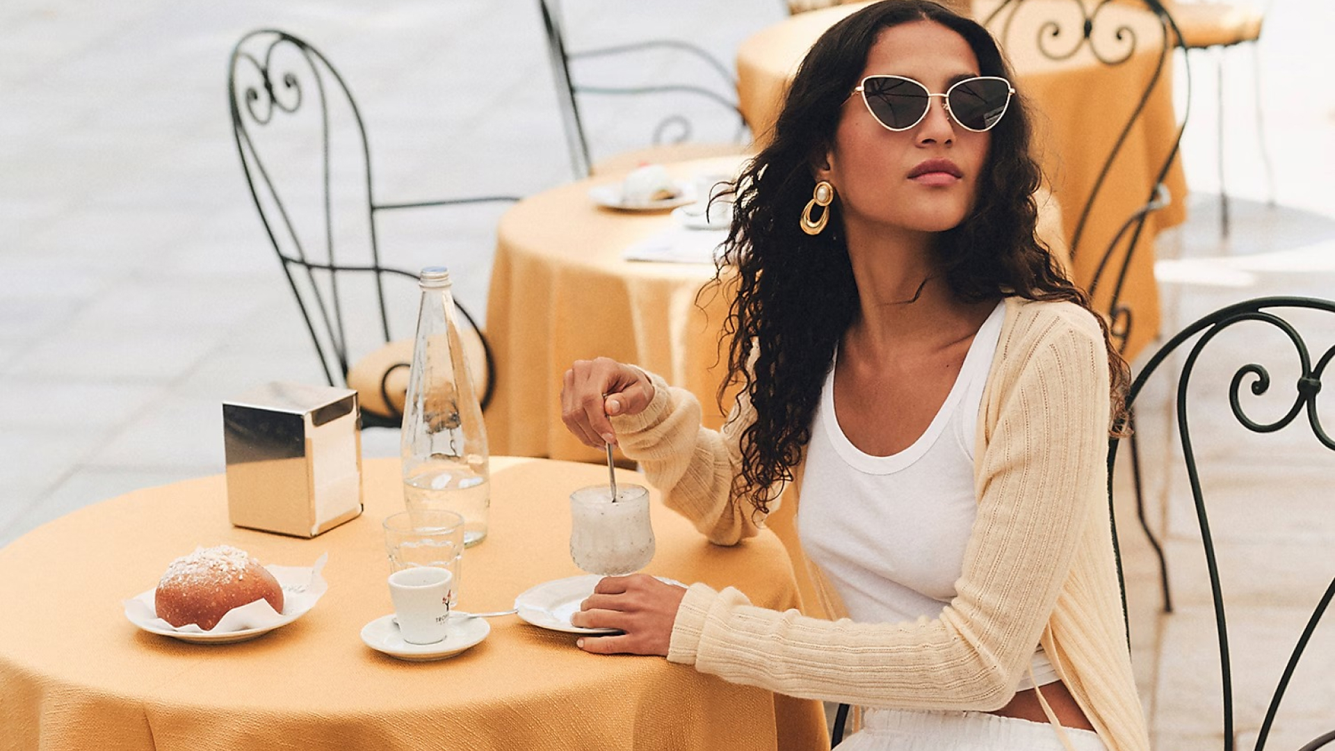 J.crew model wearing yellow Featherweight Cashmere Tie-Front Cardigan while sitting at a breakfast table