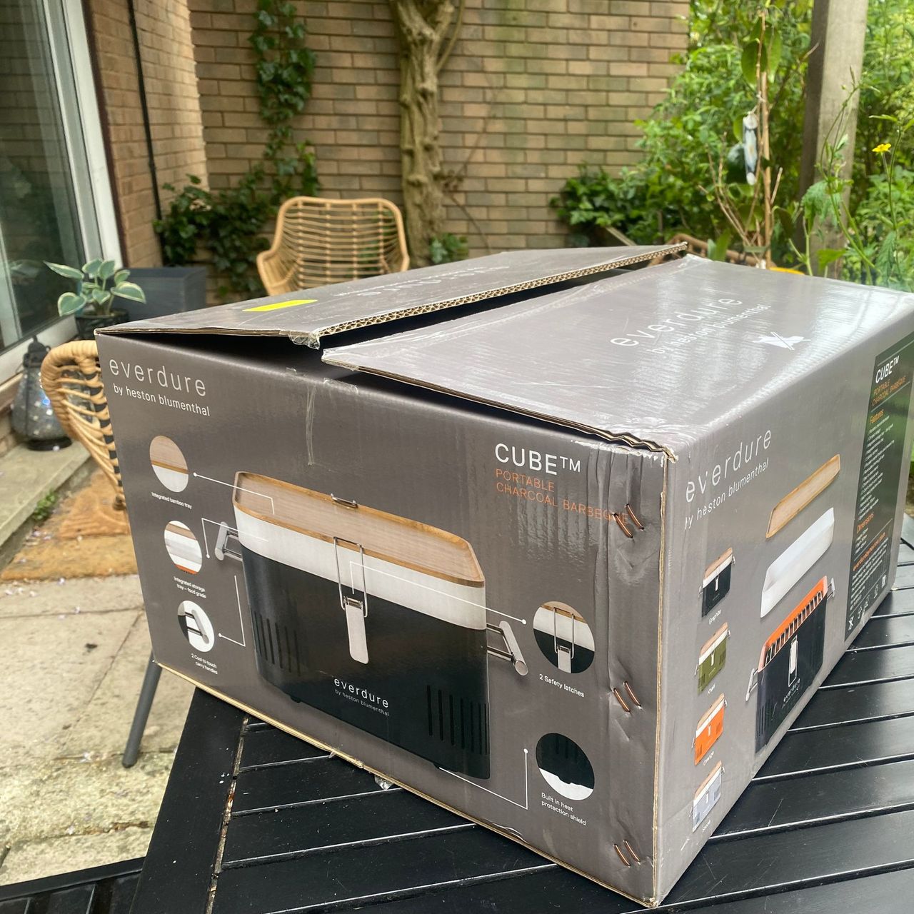 Everdure Cube BBQ in box on garden table