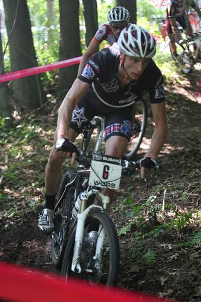 Tristan Schouten (#6) follows Nathan Guerra's wheel through the singletrack, with Darrin Braun and Brian Matter in pursuit.