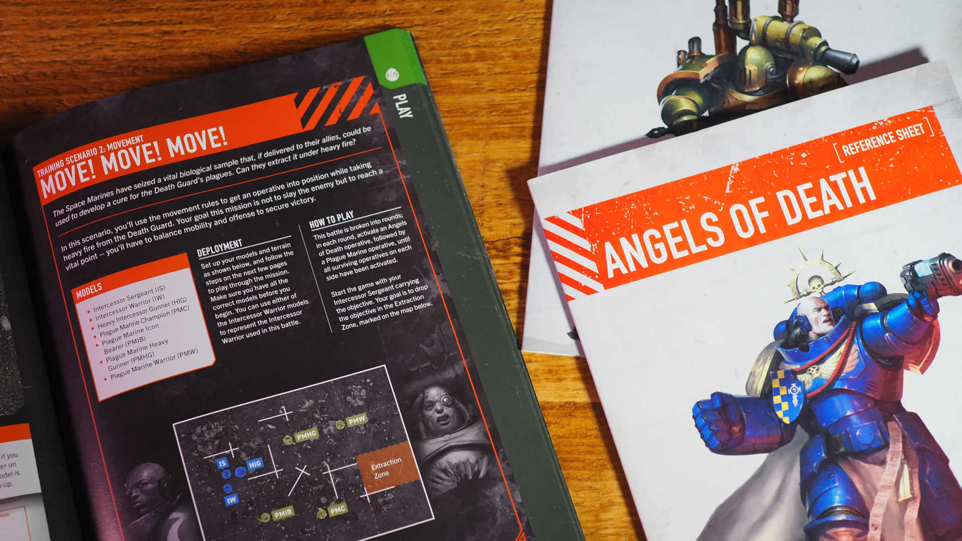 Kill Team Starter Set rulebook and datasheets on a wooden table