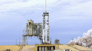 SpaceX test fires a previously flown Falcon 9 rocket booster ahead of its planned launch on June 19, 2017 to send BulgariaSat-1, the first communications satellite for Bulgaria, into orbit from Pad 39A of NASA's Kennedy Space Center in Cape Canaveral, Flo