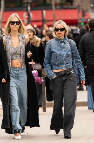 Stephanie Broek wearing a blue denim Chanel jacket and bag, Chanel broach and boots, black jeans and Maison Margiela sunglasses outside the Chanel show during the Womenswear Fall/Winter 2024/2025 as part of Paris Fashion Week on March 05, 2024 in Paris, France.