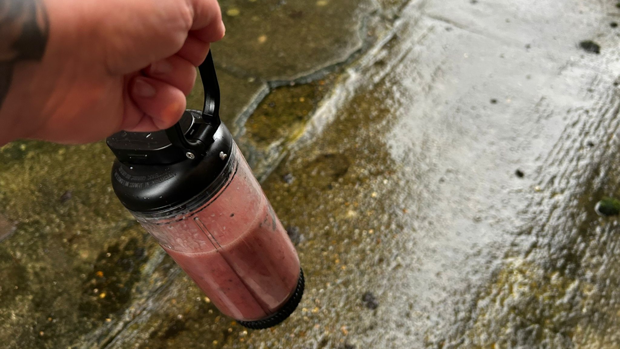 Nutribullet Flex blender being held with carry loop