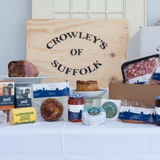 A wooden box surrounded by provisions