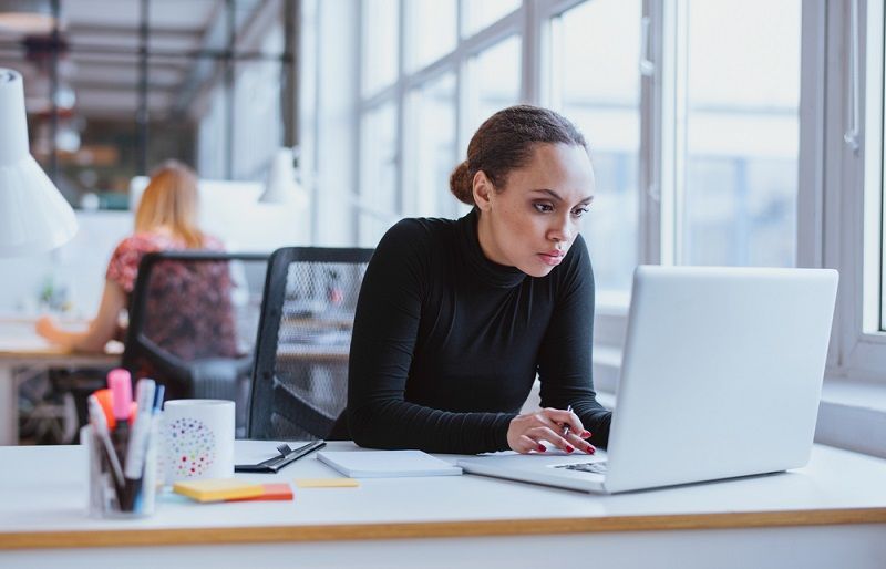 Woman sitting at a desk.