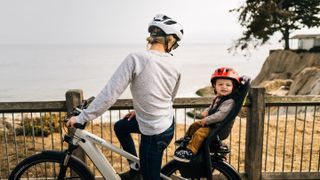 A woman and her baby on a bike