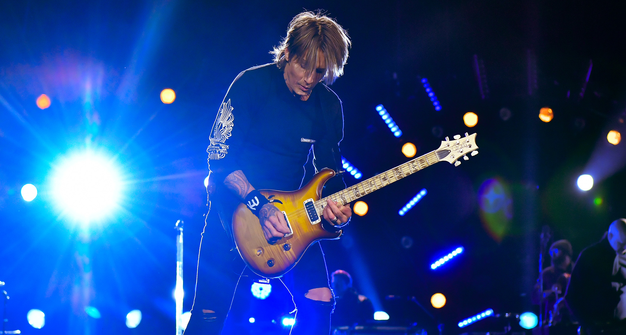 Keith Urban plays a semi-hollow PRS onstage in Nashville, 2024. He is currently developing a new signature model with the Maryland-based high-end guitar company.