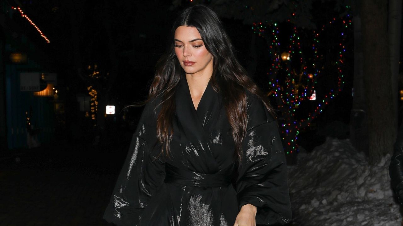 Kendall Jenner in a black puffer coat and leggings in Aspen.