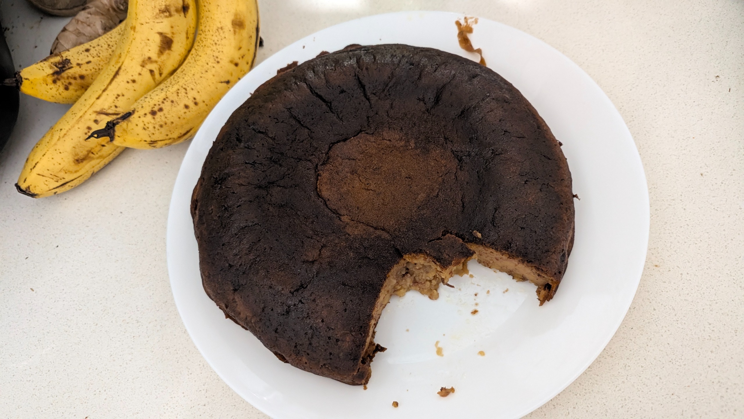 A partially eaten banana bread loaf cooked with the Midea 5L Induction Rice Cooker