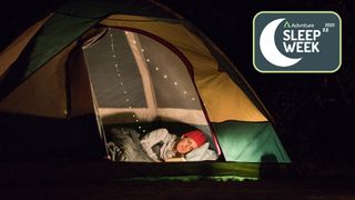 Woman sleeping on her side in tent