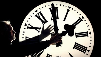 Man setting clock