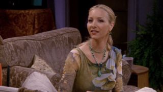 Phoebe sitting in a chair in Friends