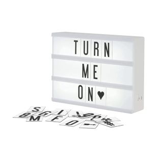 A lightbox with letters on it and next to it
