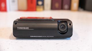 The Thinkware T700 dash cam sitting on a kitchen table