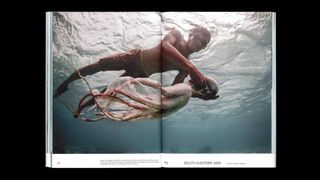 Double page photo of a man catching an octopus underwater, from Migrant Journal