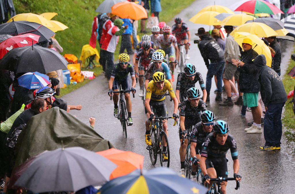 The GC group riding through the rain on the Col de Joux Plane during stage 20