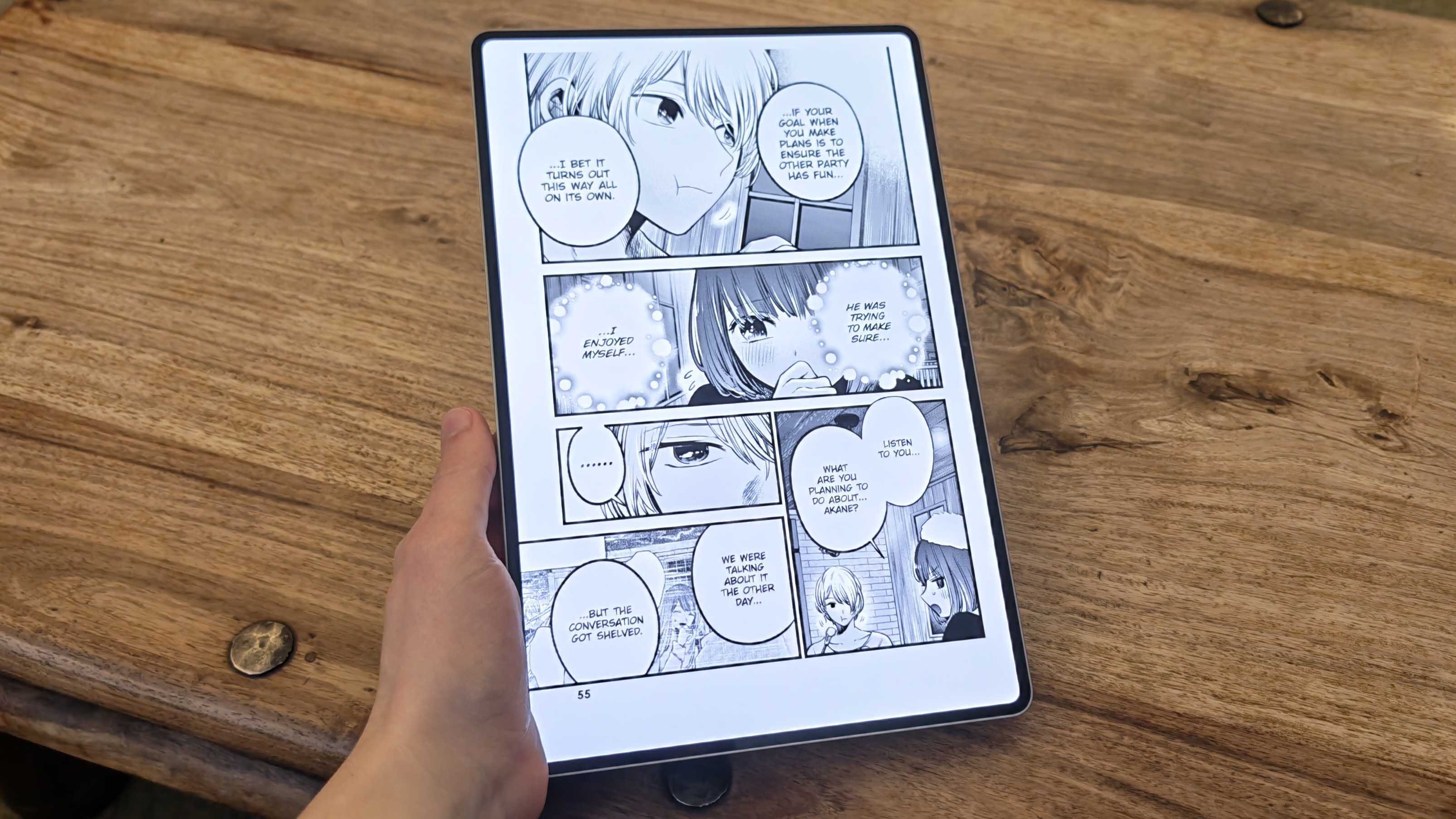 A photograph of the Honor MagicPad 4 in use on a wooden table.