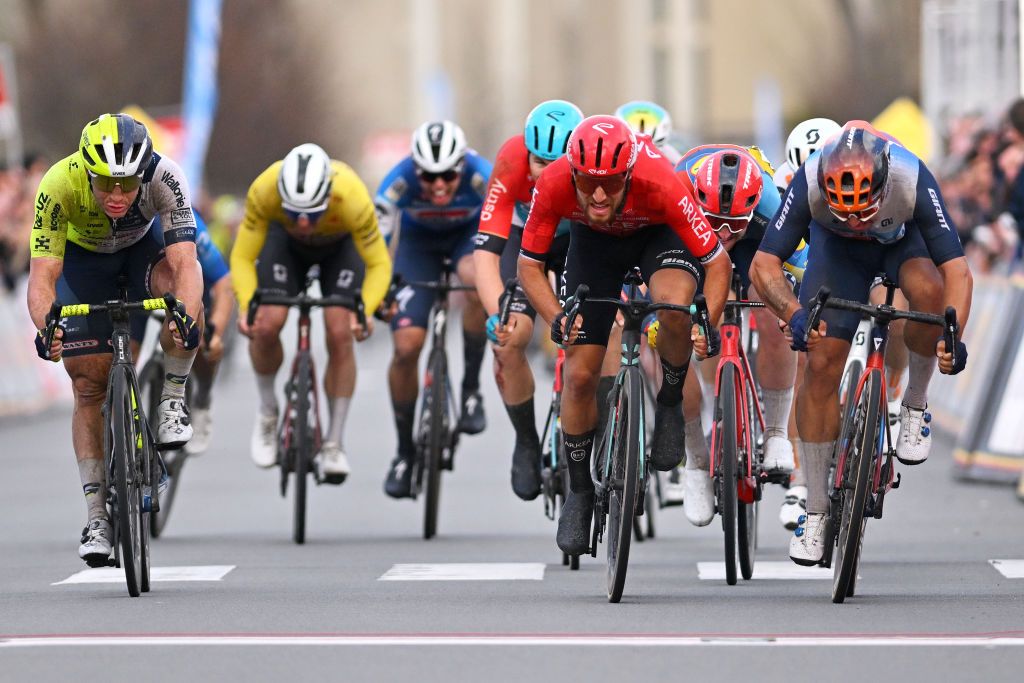 KOKSIJDE BELGIUM MARCH 15 LR Gerben Thijssen of Belgium and Team Intermarche Wanty race winner Luca Mozzato of Italy and Team Arkea BB Hotels and Dylan Groenewegen of The Netherlands and Team Jayco AlUla sprint at finish line during the 22nd Bredene Koksijde Classic 2024 a 2012km one day race from Bredene to Koksijde on March 15 2024 in Koksijde Belgium Photo by Luc ClaessenGetty Images