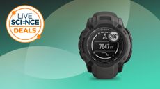 Garmin Instinct 2X Solar on a green background