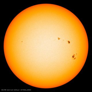 Two large sunspots are visible on the right side of the sun in this image taken by NASA's Solar Dynamics Observatory.
