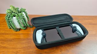 Venom PlayStation Portal Carry Case with PS Portal and plant on table